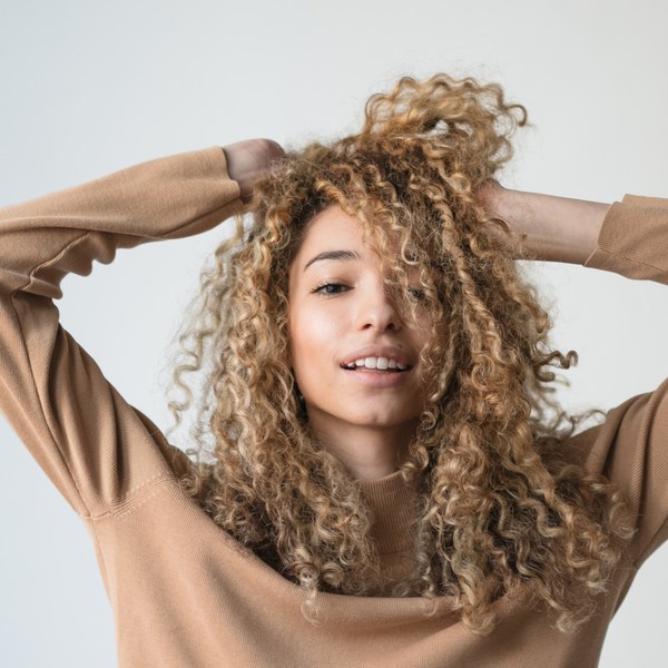 Woman with curly blonde hair